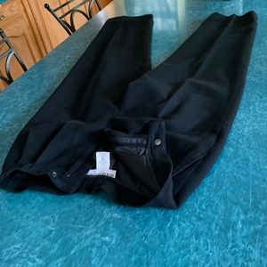 Black wool slacks w/ pleats, side pockets & lined.